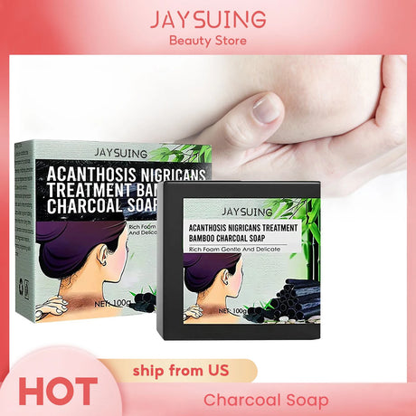 Jaysuing Acanthosis Nigricans Treatment Bamboo Charcoal Soap packaging with a hand holding it, on a pink background.
