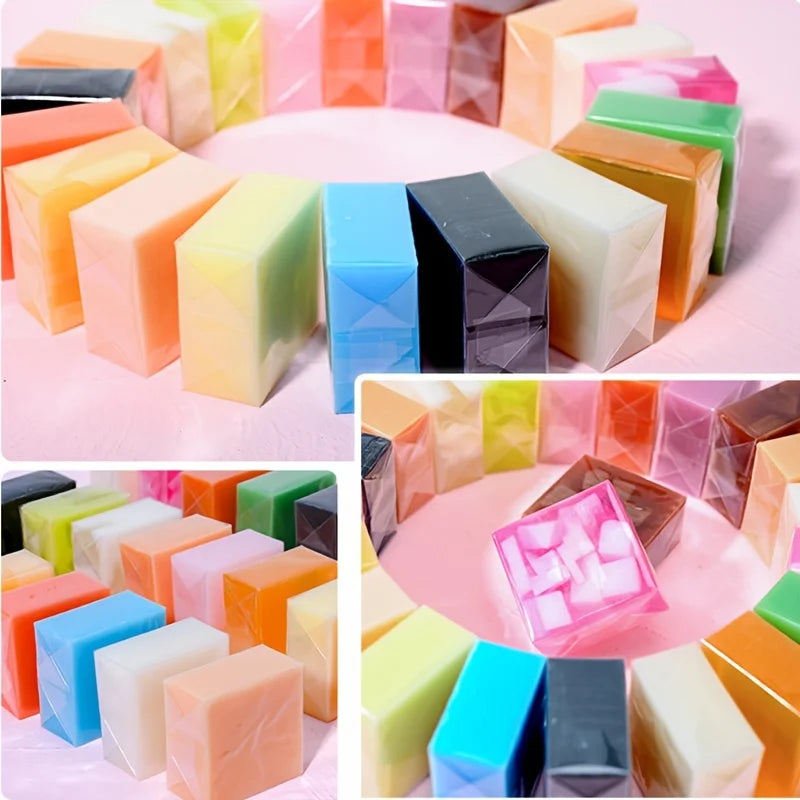 Colorful soap bars arranged in a circular pattern on a pink surface.