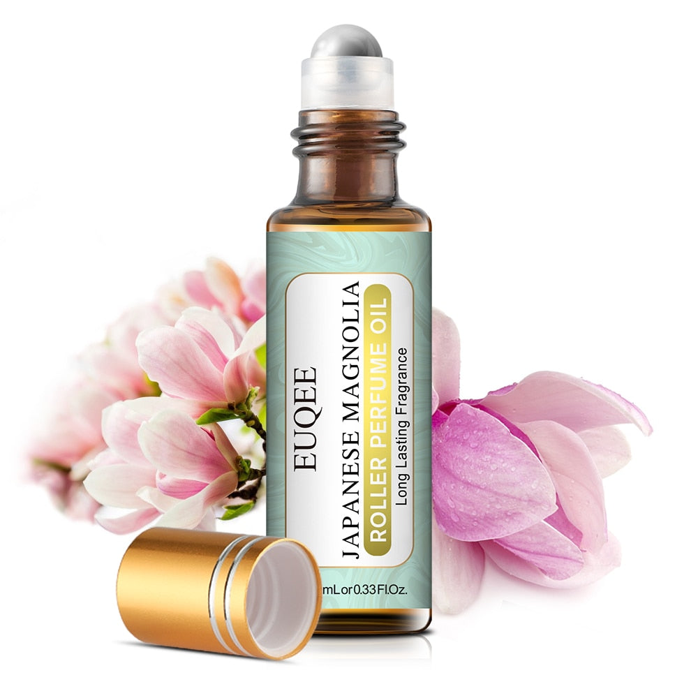 EUQUEE Japanese Magnolia roller perfume oil with pink flowers on a white background