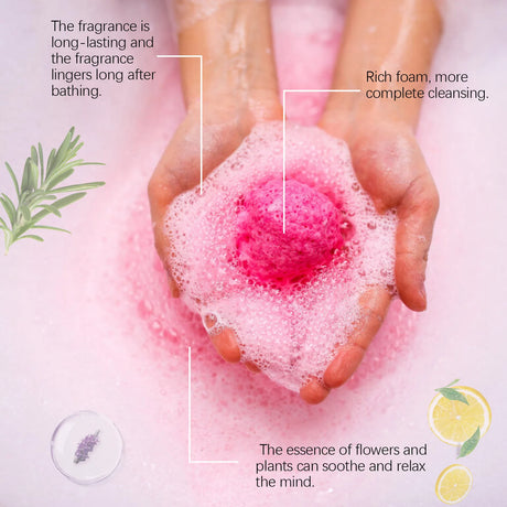 Hand holding a pink bath bomb with text about its fragrance and cleansing properties.