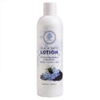 White bottle of Black Seed Lotion with floral design on a white background