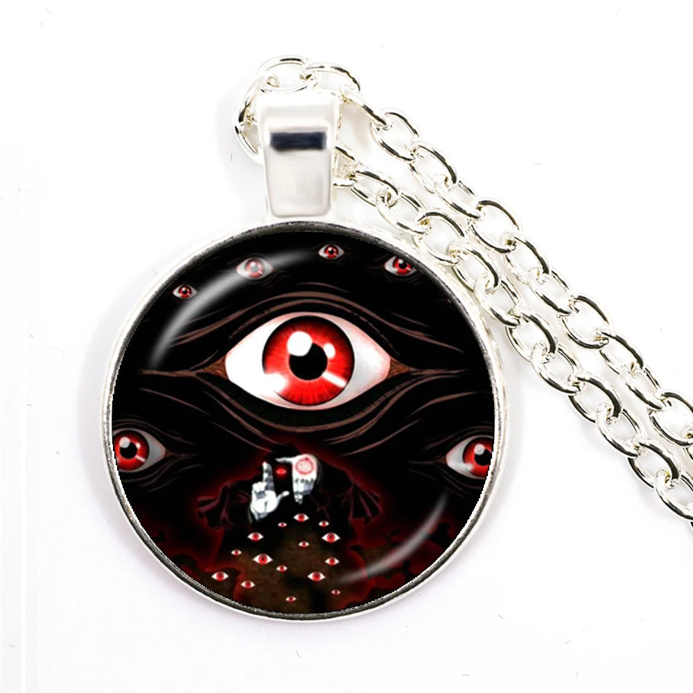 Pendant with eye design on a chain against a white background