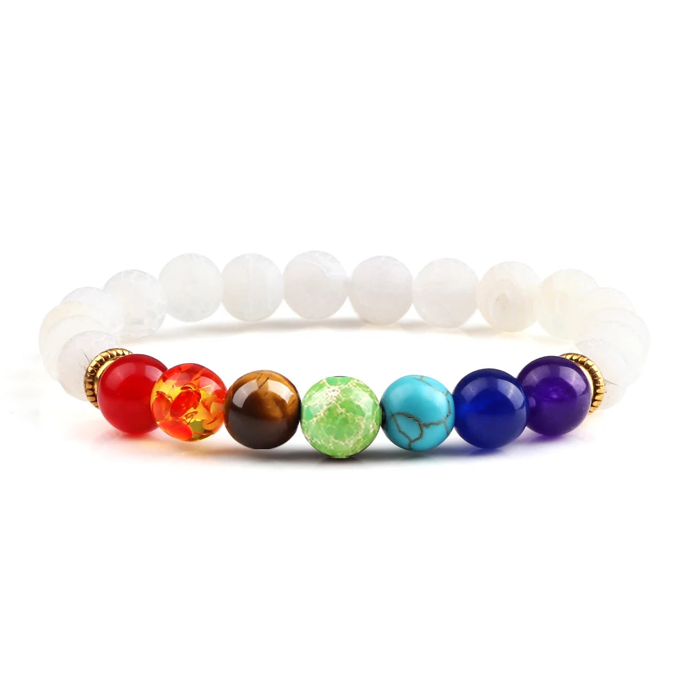 Bracelet with white beads and colorful gemstone beads on a white background