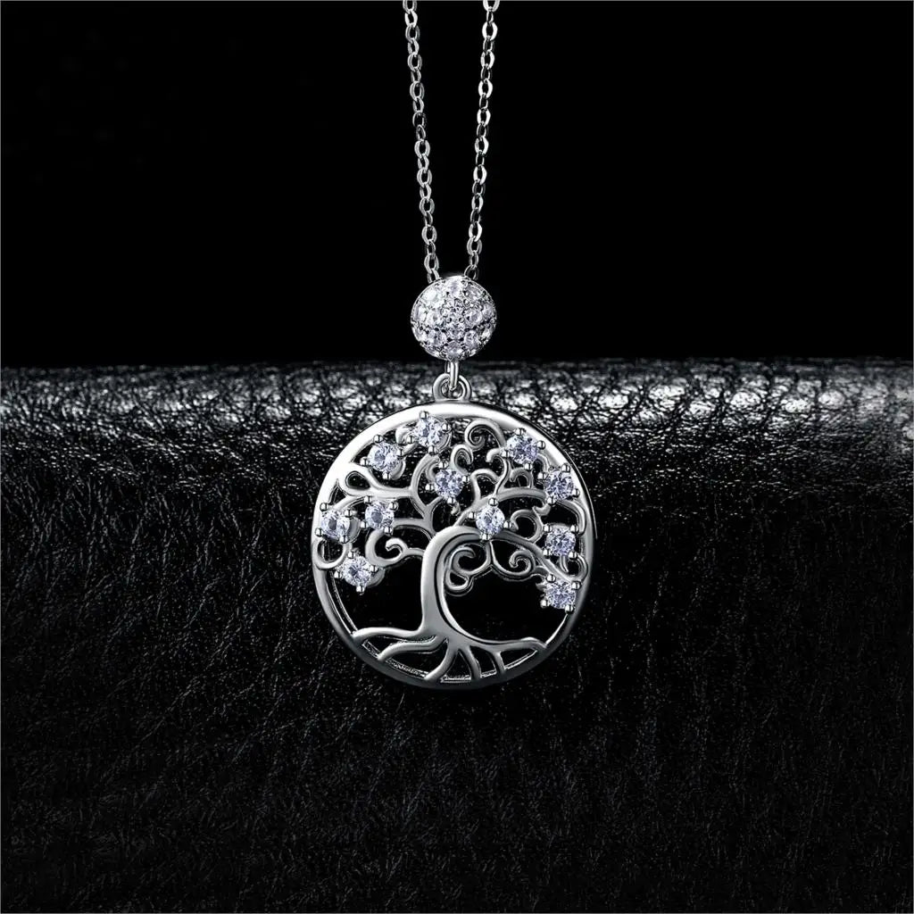 Silver tree of life pendant necklace on a black background
