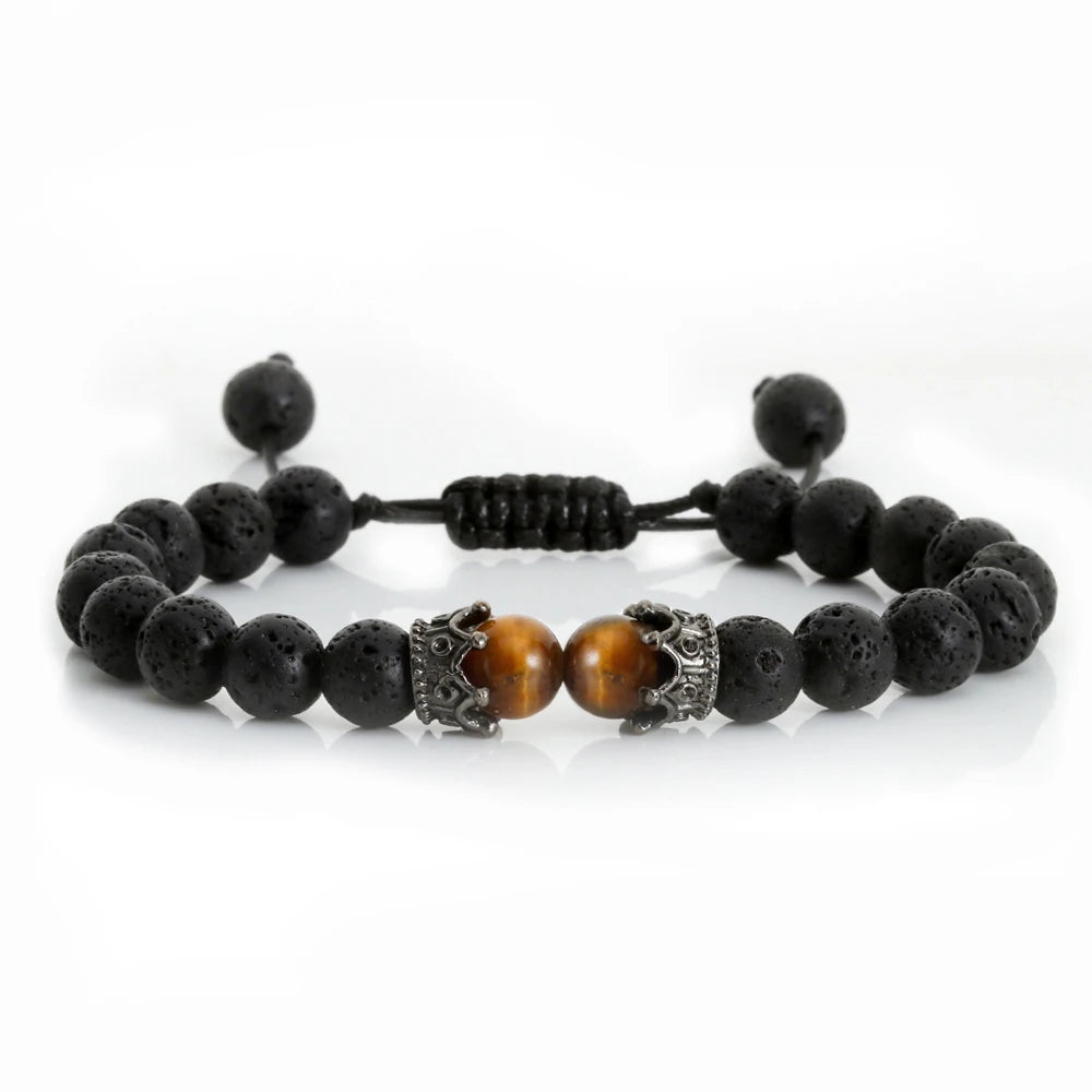 Black beaded bracelet with a central brown bead on a white background