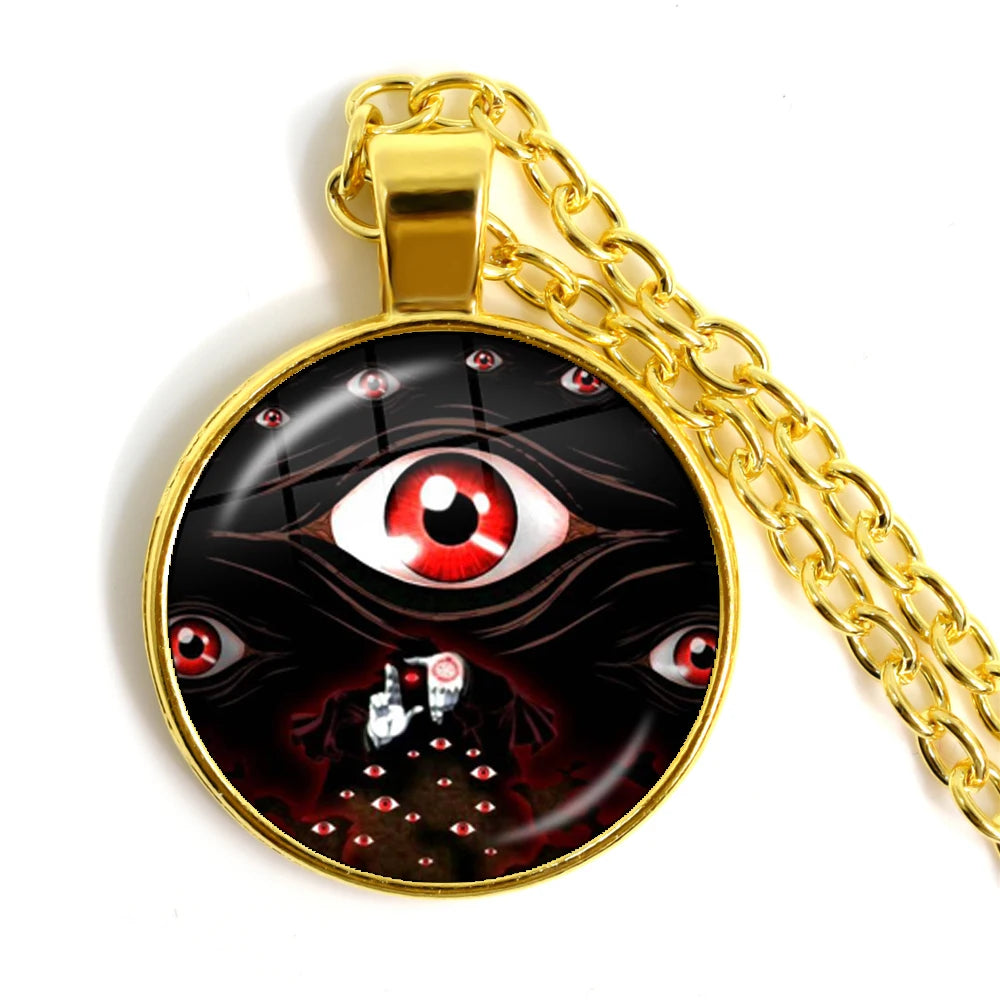 Gold chain necklace with a pendant featuring an eye design on a white background