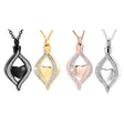 Four heart-shaped pendant necklaces in black, gold, rose gold, and silver on a white background.