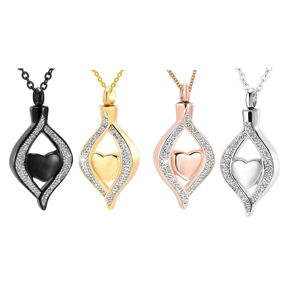 Four heart-shaped pendant necklaces in black, gold, rose gold, and silver on a white background.