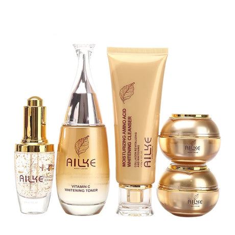 AILKE skincare product set including serum, toner, cleanser, and cream on a white background