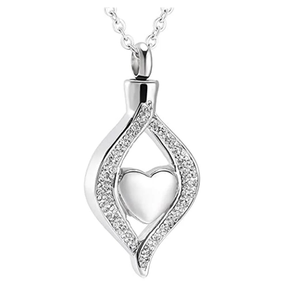 Silver pendant with heart design on a white background