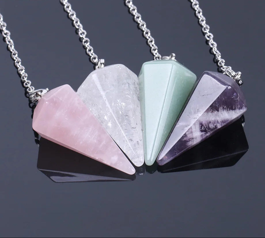 Necklace with geometric stone pendants on a dark background