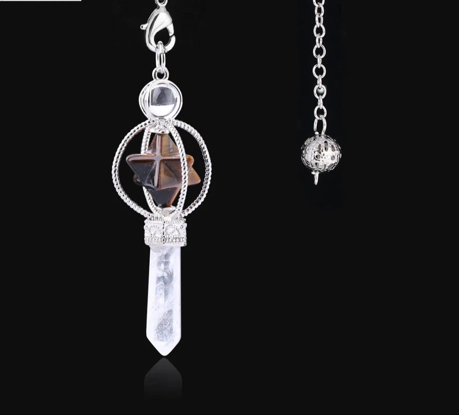 Jewelry pendant with star and crystal design on a black background