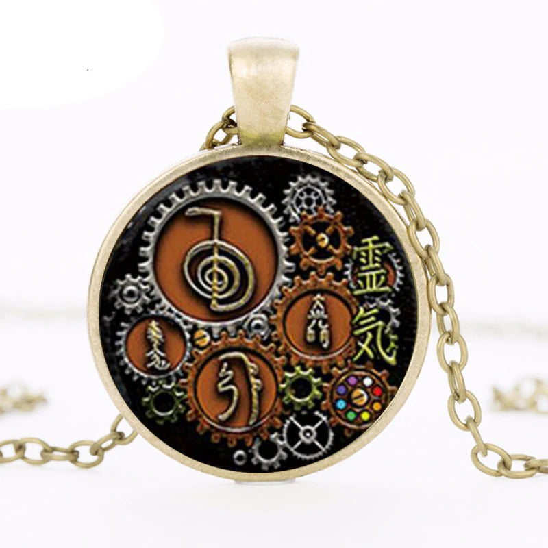 Necklace with a round pendant featuring gears and symbols on a white background