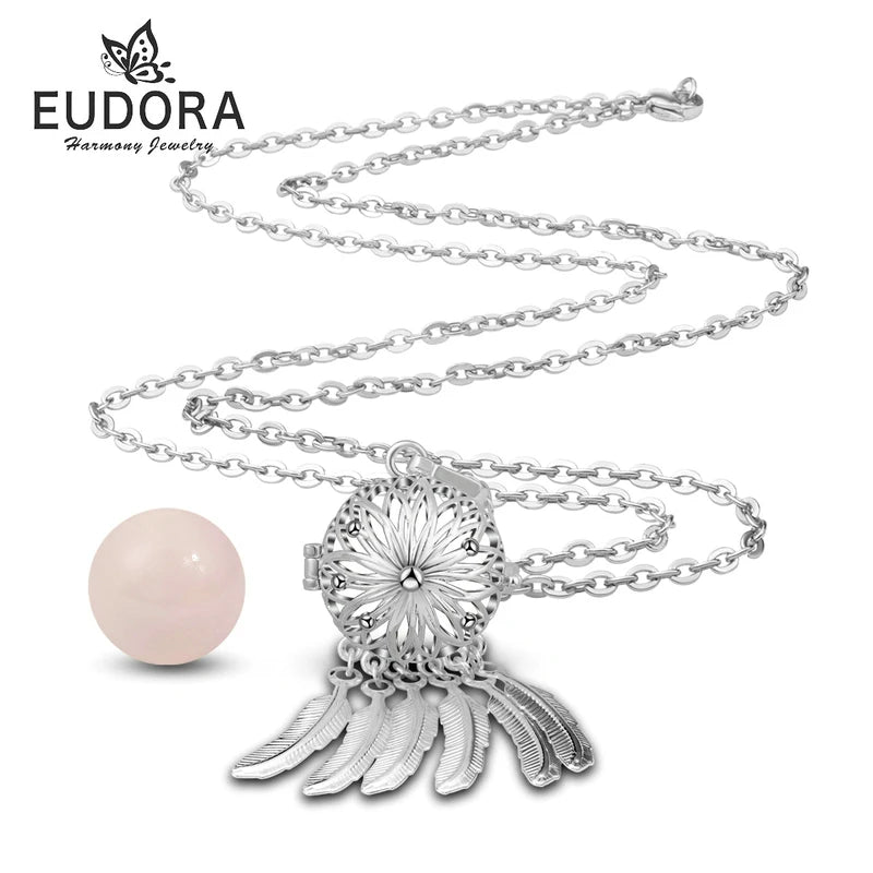 Silver necklace with a pink pendant on a white background, featuring the Eudora brand.