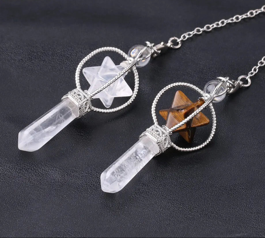 Crystal pendant necklace with star design on a dark background