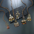 Feathered necklaces with tassels on a textured surface