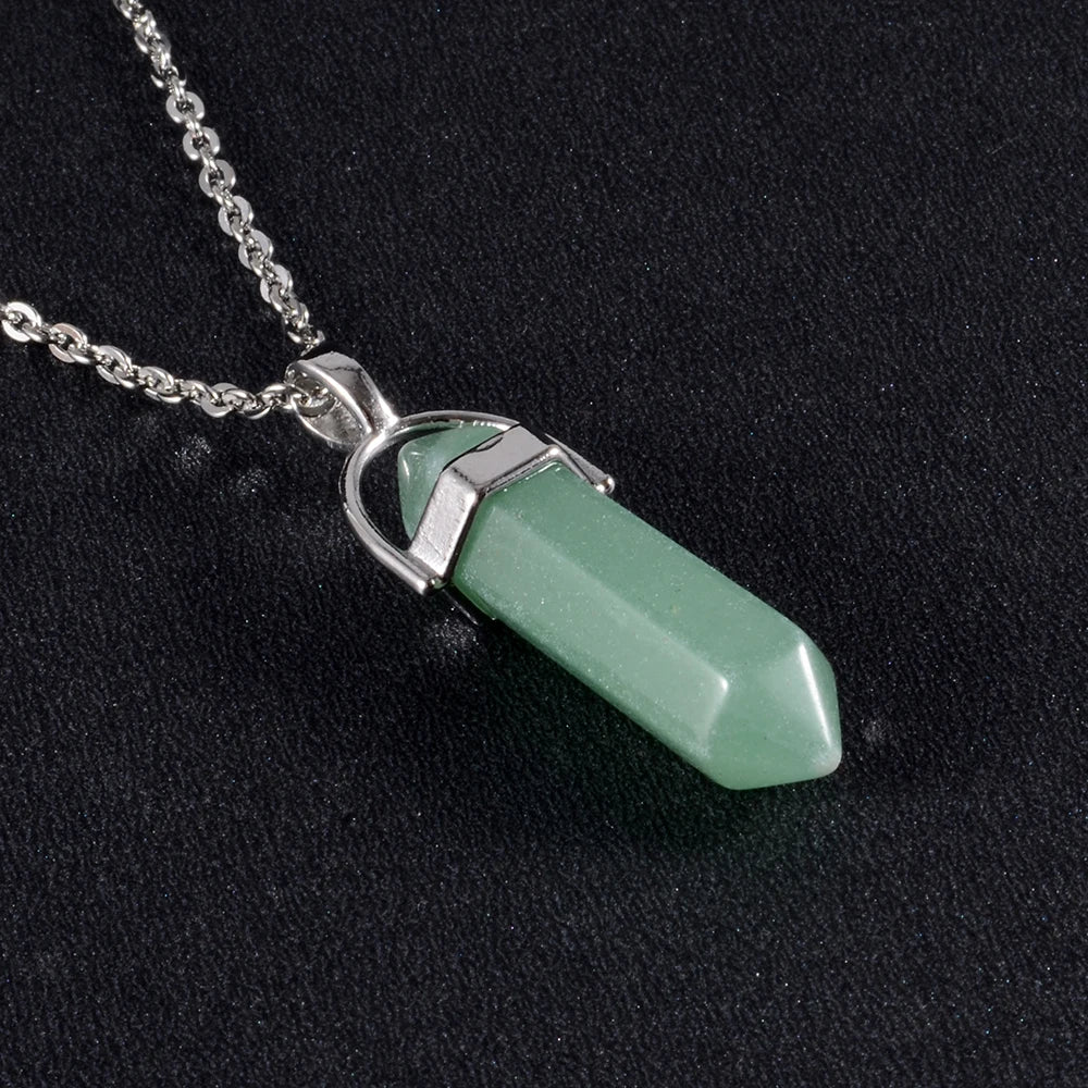 Necklace with a green pendant on a black background