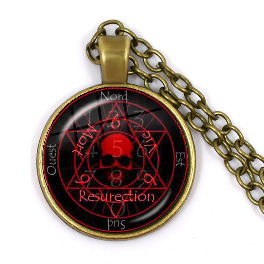 Pendant with red and black design on a white background