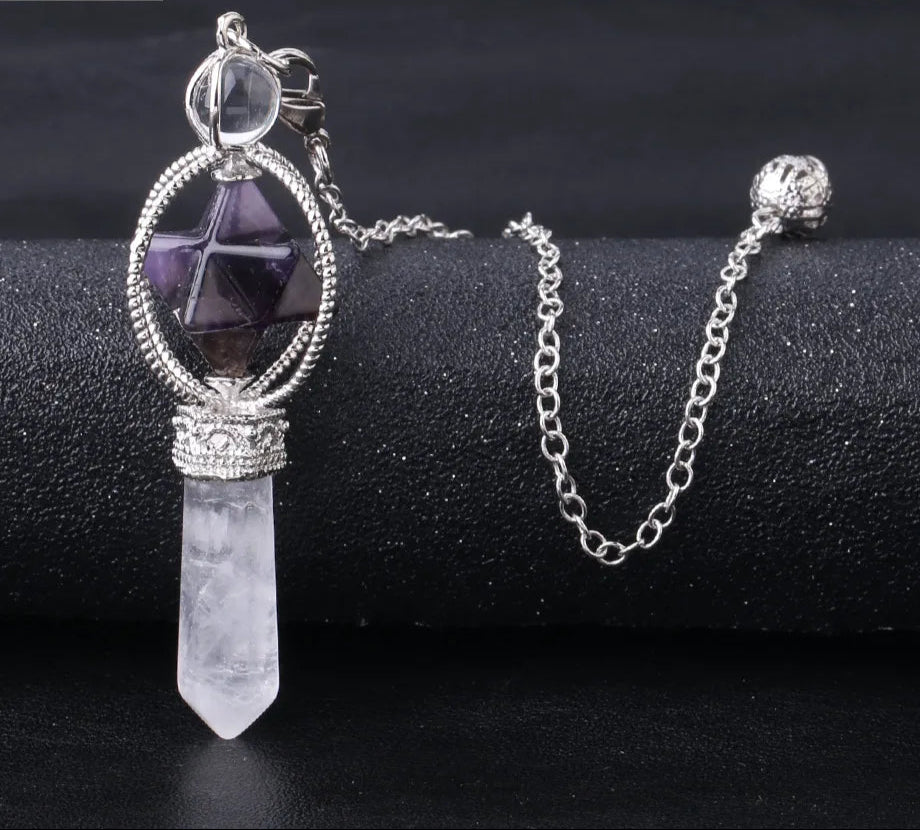 Crystal pendant necklace on a black surface with 'Cala Jewelry' logo.