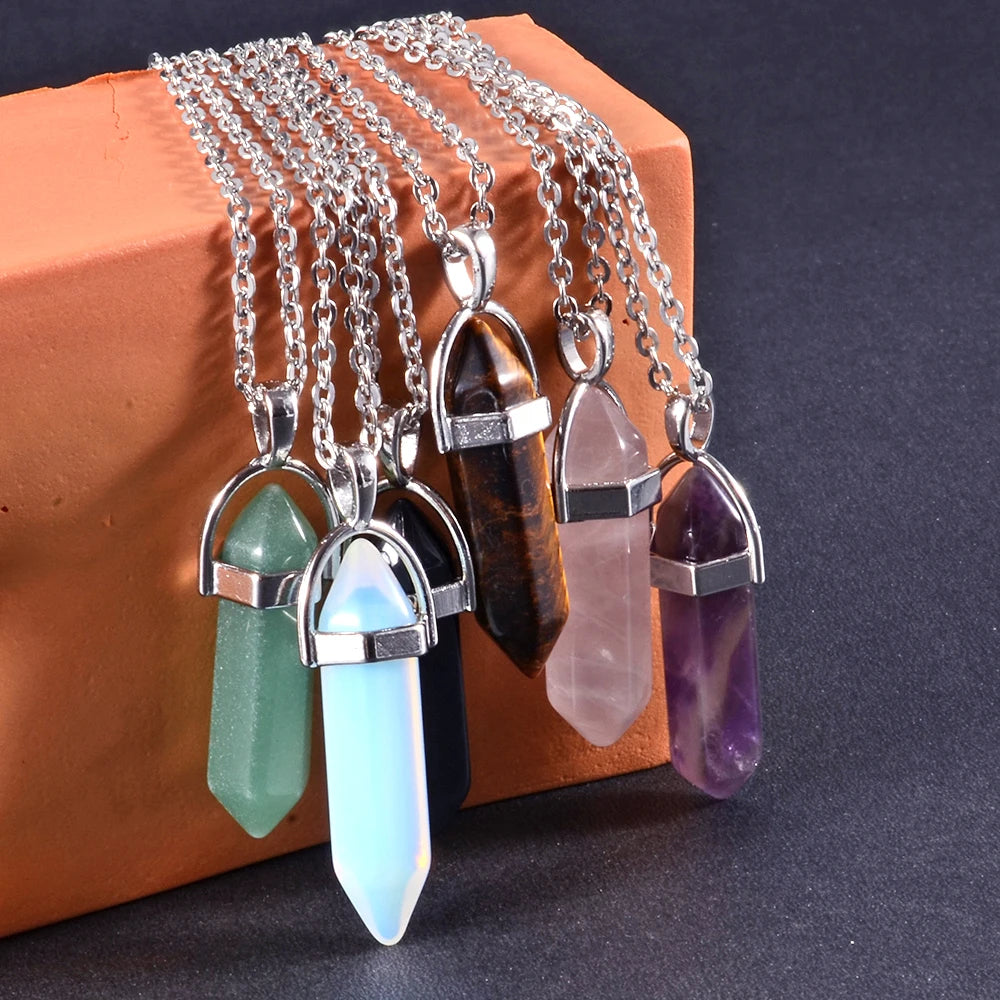 Necklaces with crystal pendants on a dark background