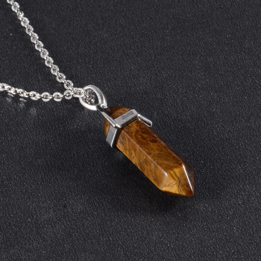 Necklace with a brown crystal pendant on a black background