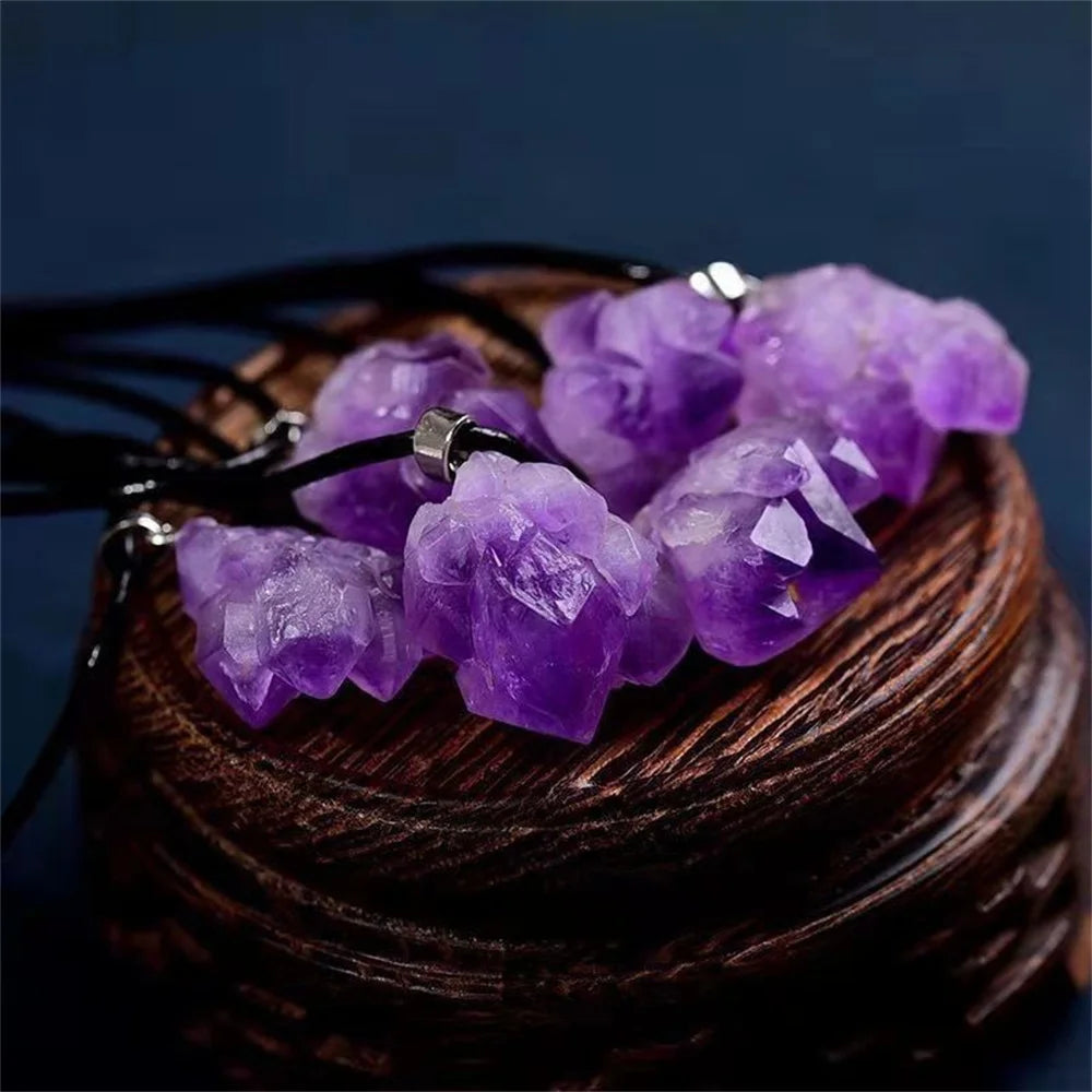 Purple crystal bracelet on a wooden surface with a dark background