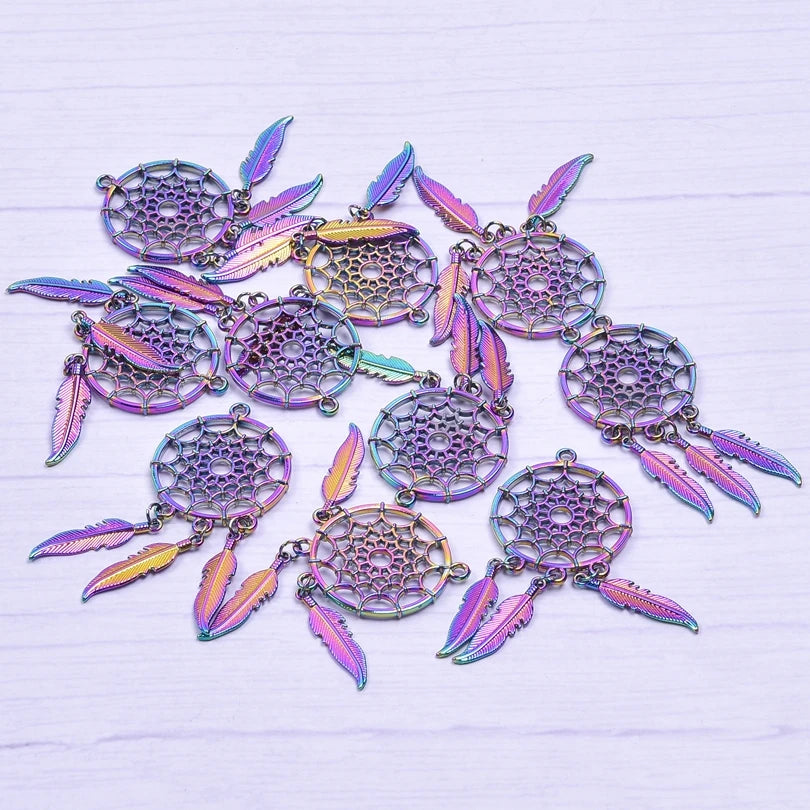 Iridescent dreamcatcher pendants on a light wooden surface