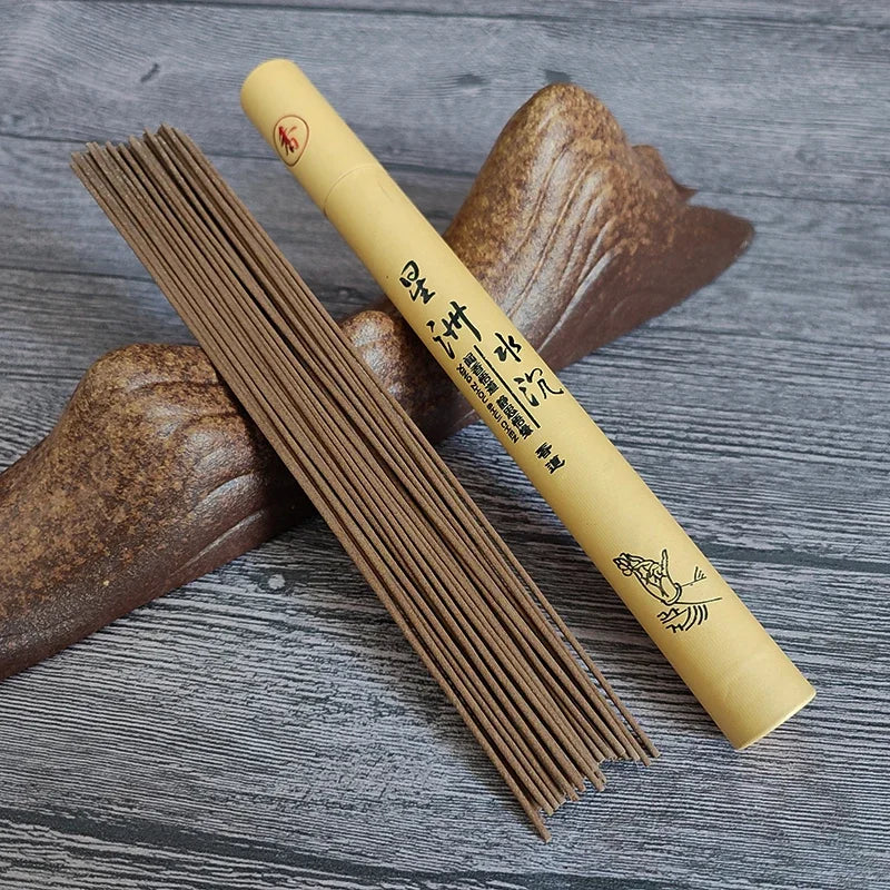Incense sticks and their packaging on a wooden surface