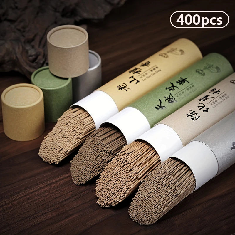 Incense sticks in paper tubes on a wooden surface with '400pcs' text above.