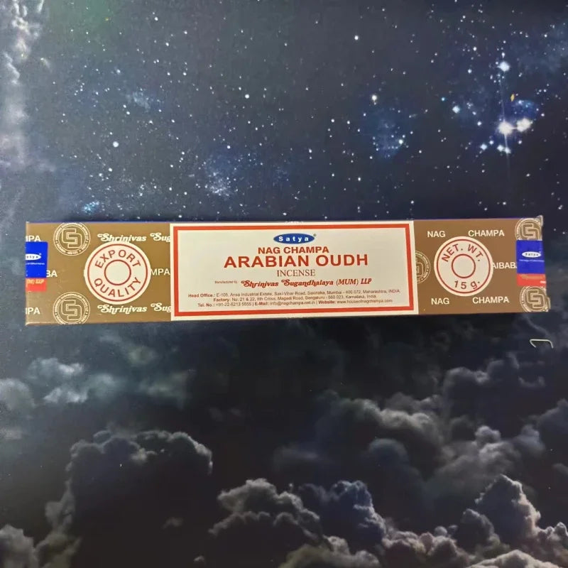 Box of Nag Champa Arabian Oudh incense against a starry night sky background