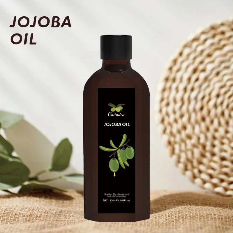 Jojoba oil bottle with a natural background