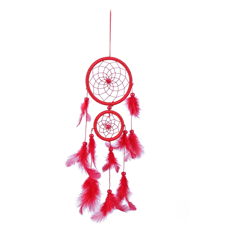 Red dreamcatcher with feathers on a white background