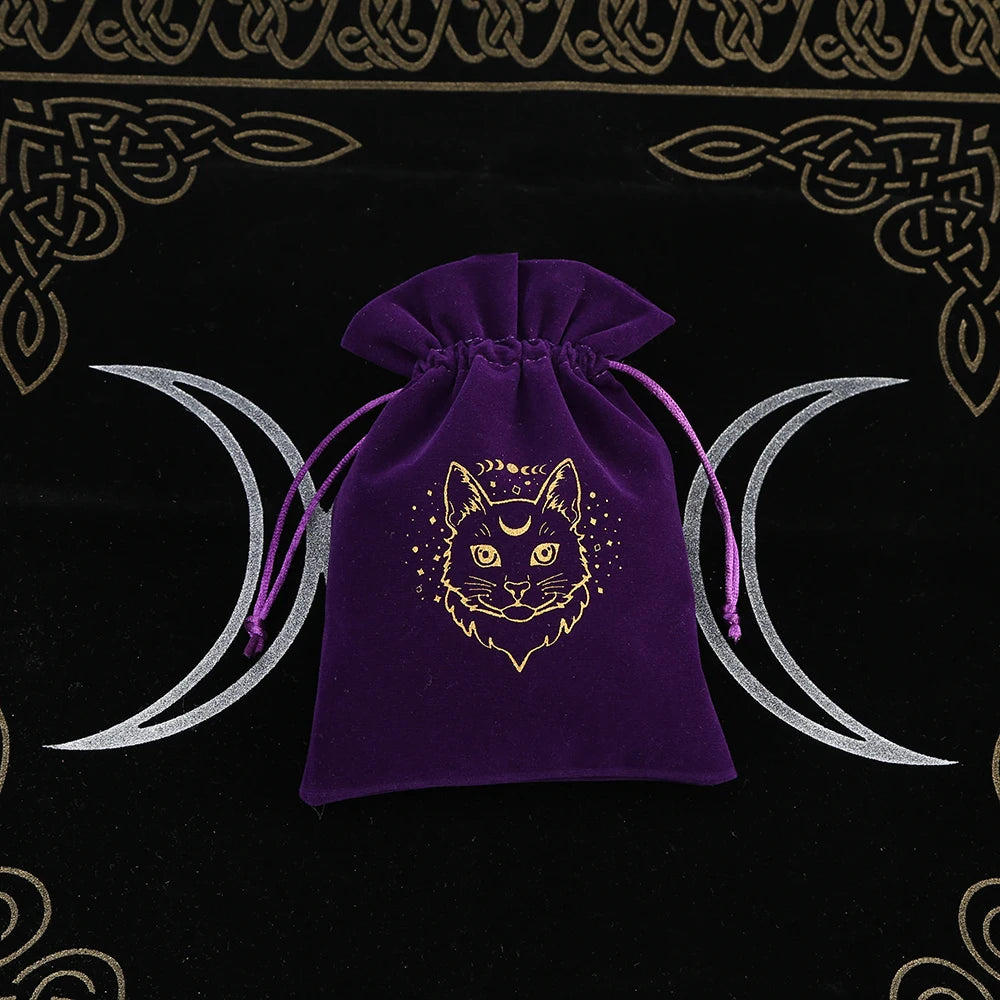 Purple drawstring bag with a cat design on a black background with moon symbols
