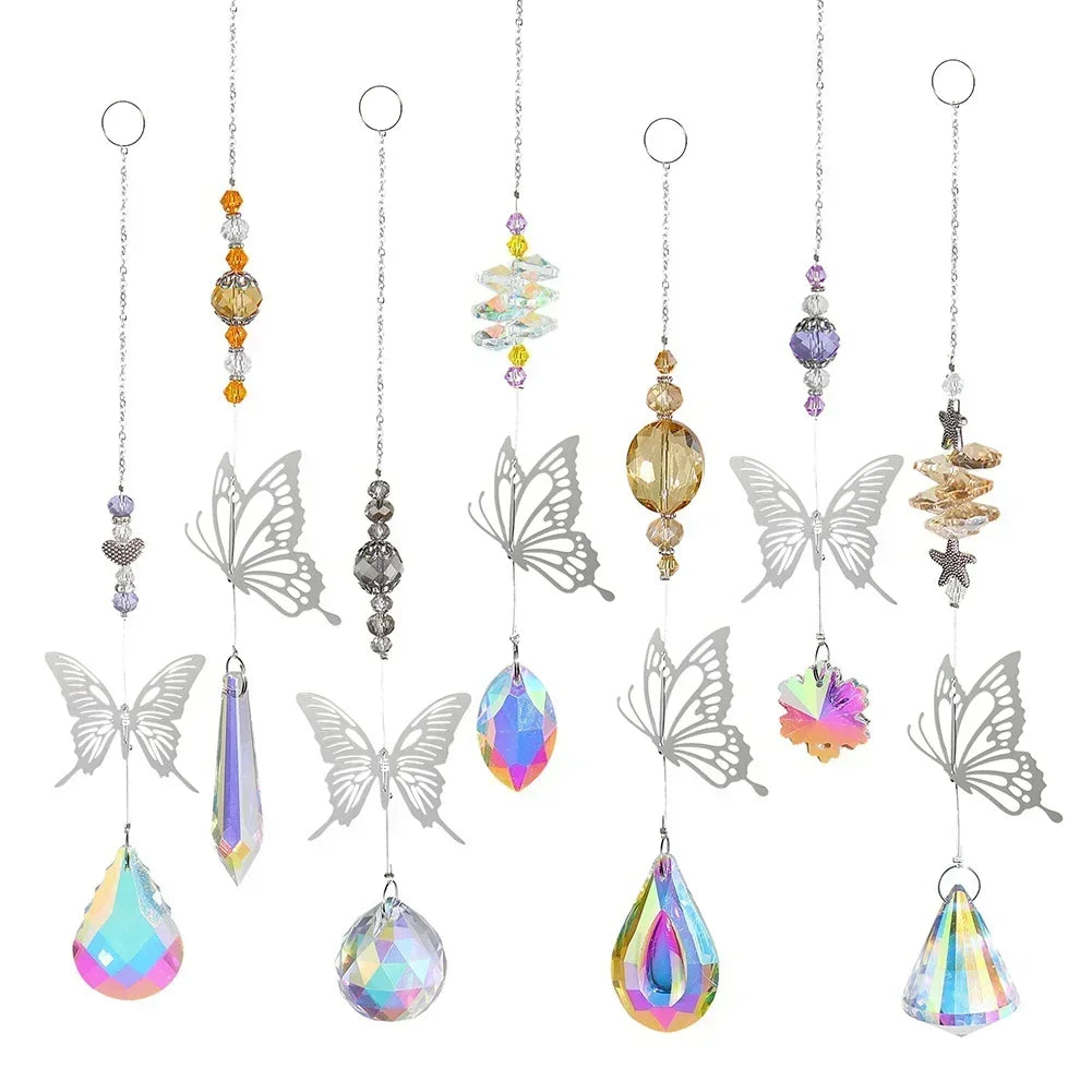 Set of hanging decorative items with butterfly and teardrop designs on a white background
