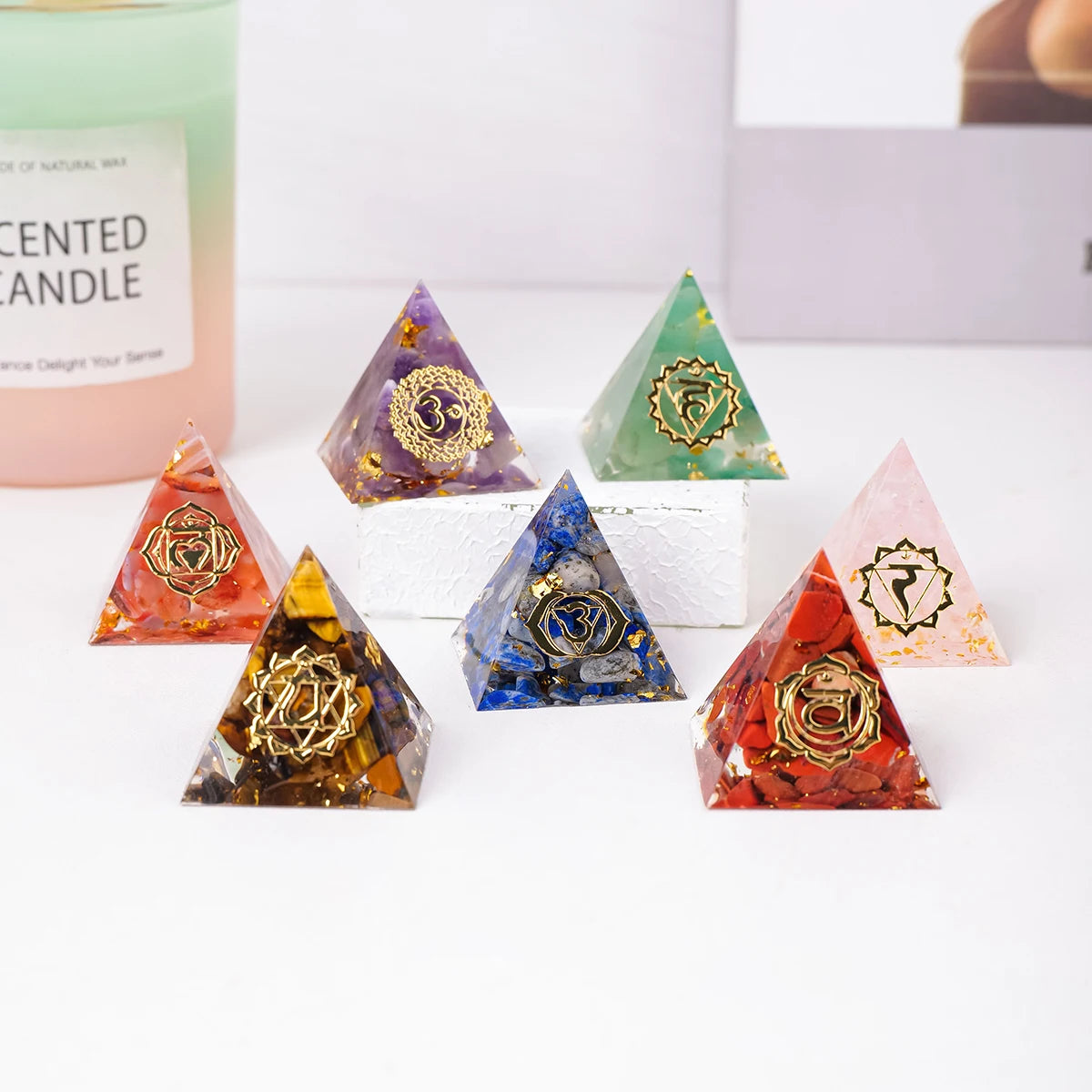Set of pyramid-shaped decorative items with colorful designs on a white surface.