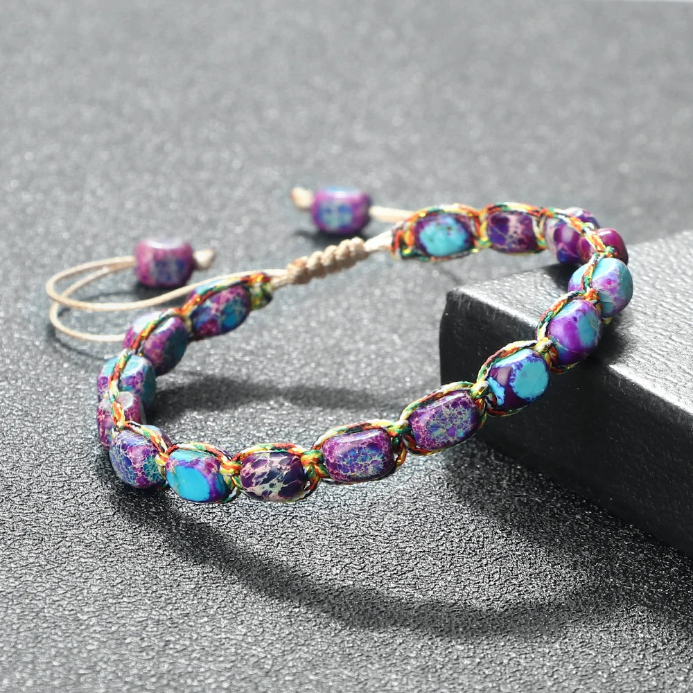 Colorful beaded headband on a gray surface