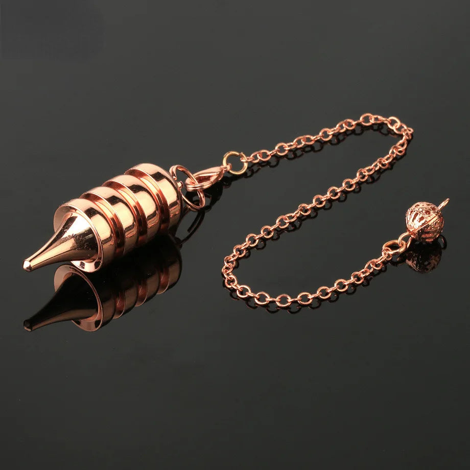 Rose gold spiral pendant on a chain against a black background