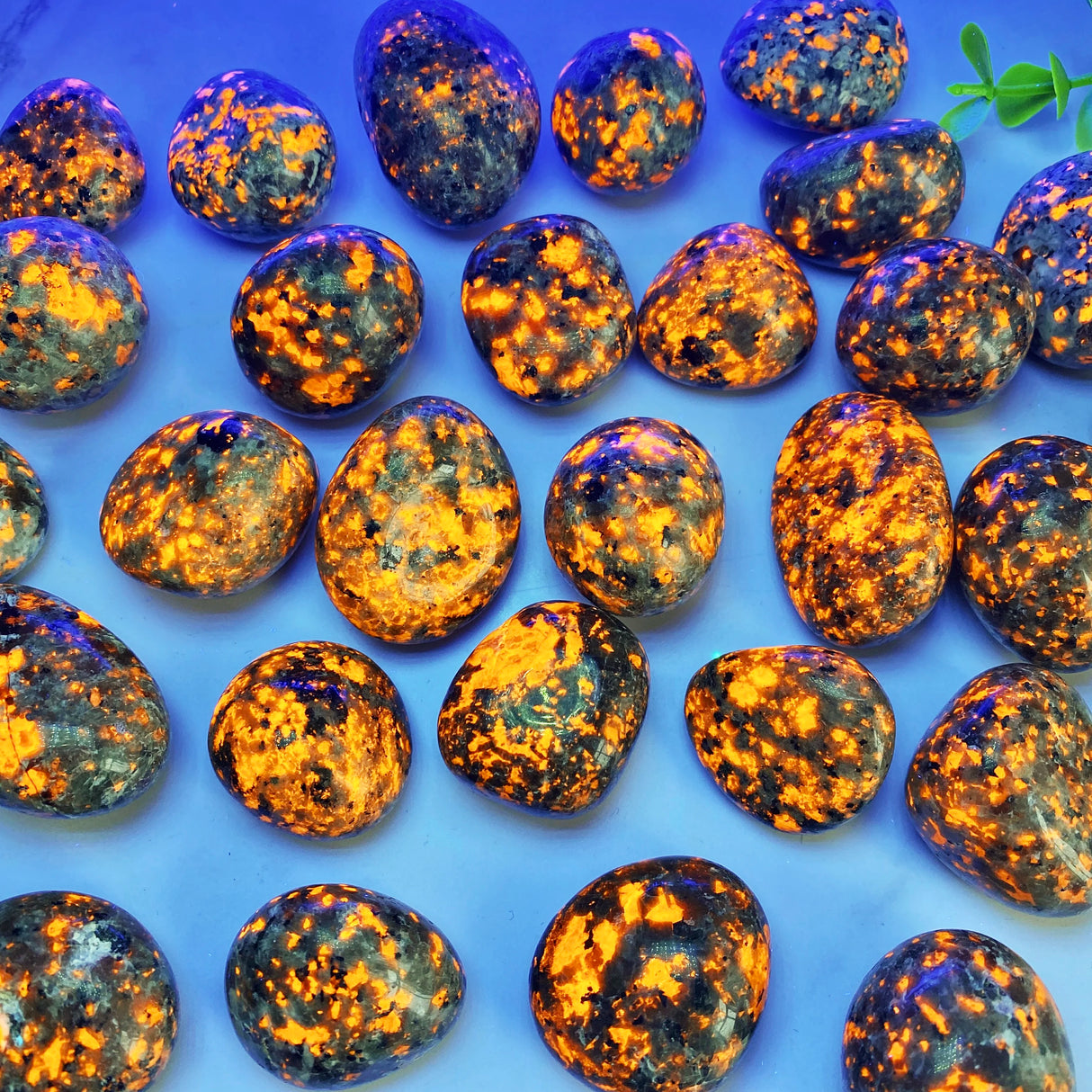 Pattern of orange and blue stones on a blue background