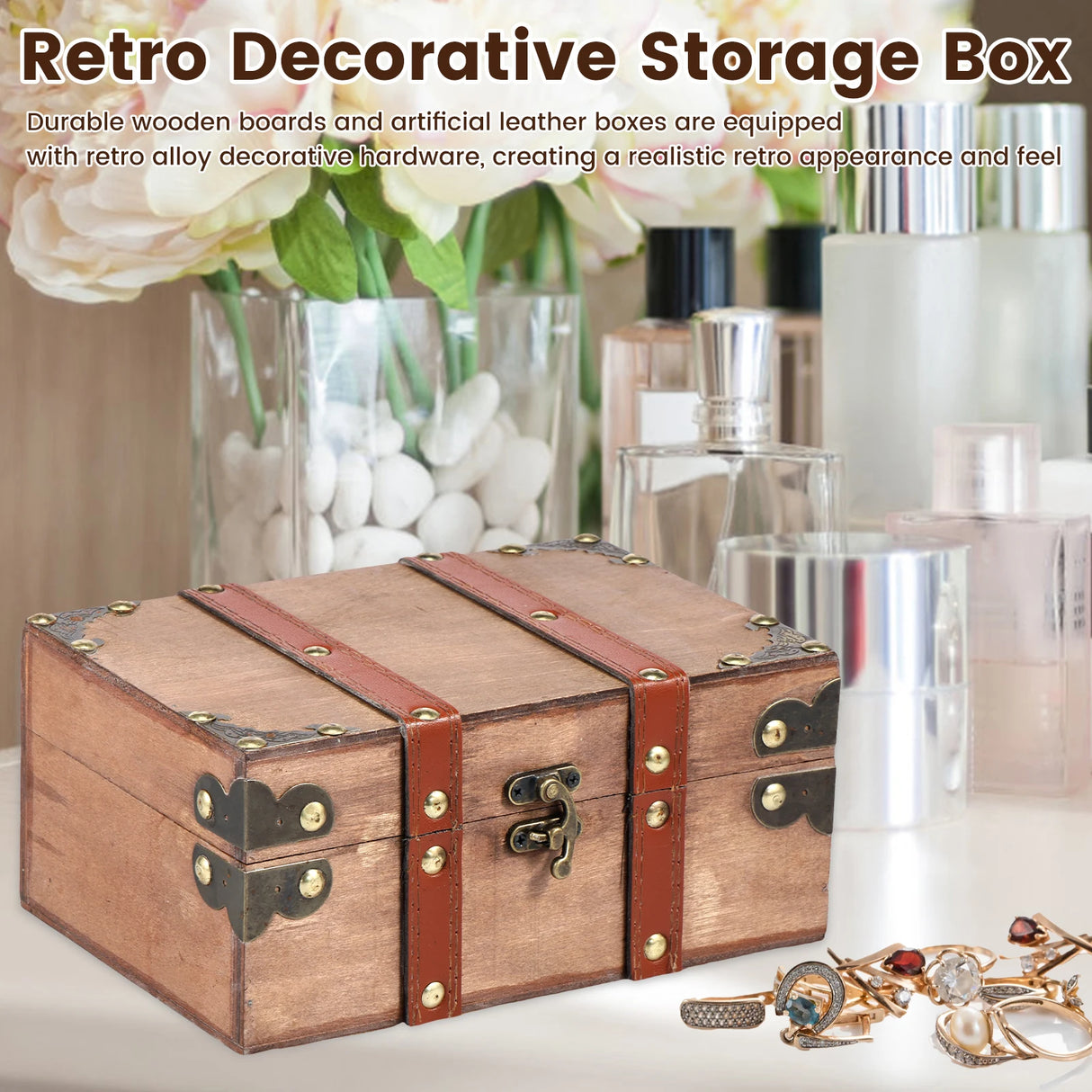 Retro decorative storage box with decorative hardware on a surface with flowers and jewelry.