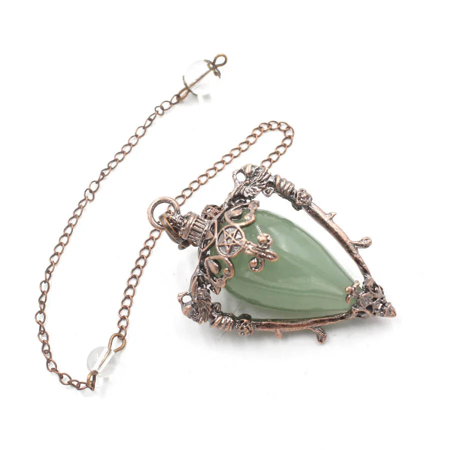 Necklace with a green pendant and intricate metalwork on a white background