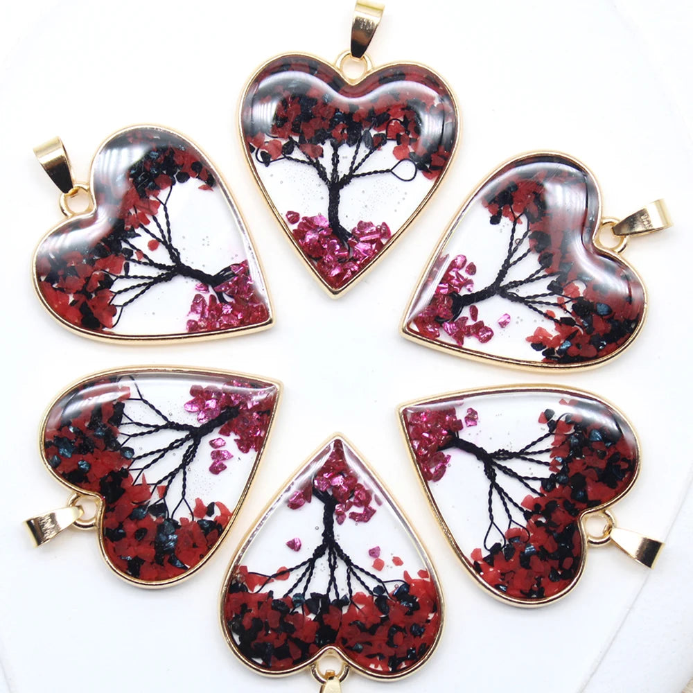 Heart-shaped pendants with floral design on a white background