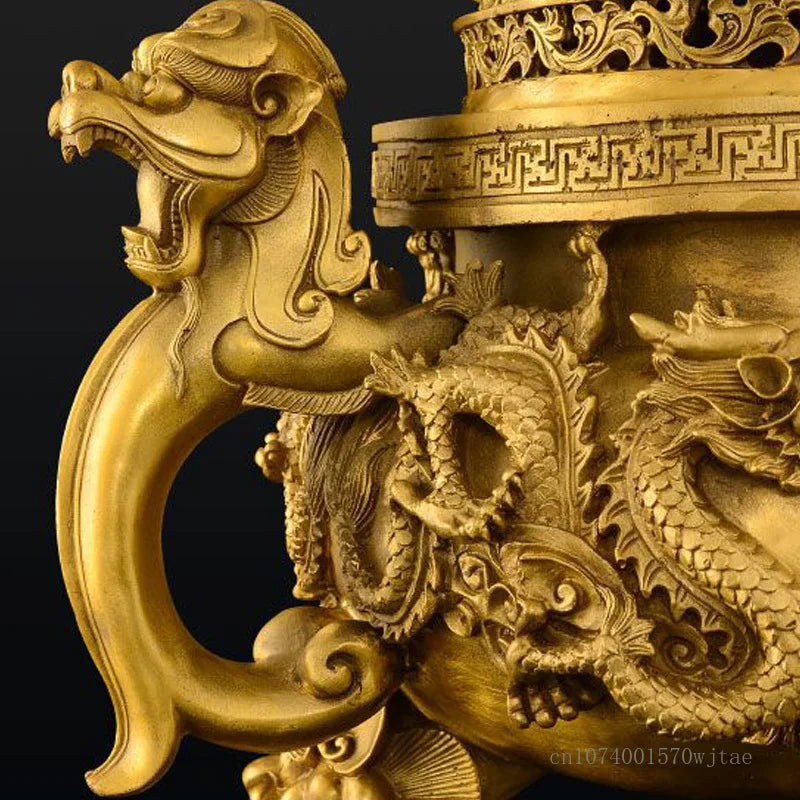 Close-up of a gold dragon sculpture on a black background