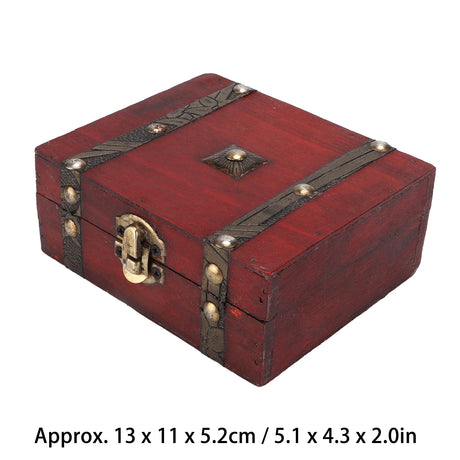 Red wooden box with decorative straps and lock on a white background