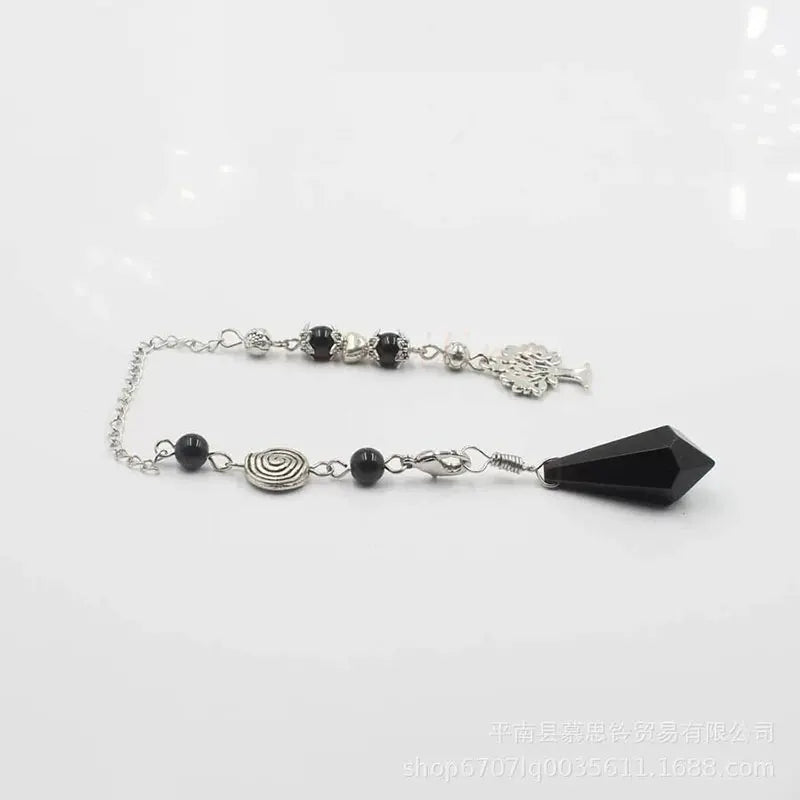 Black beaded bracelet with a large black gemstone on a white background