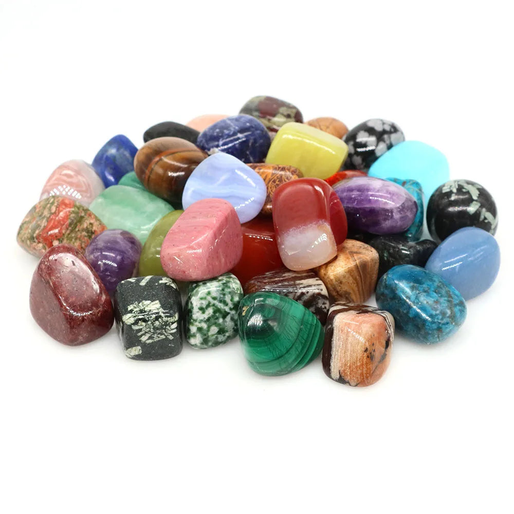 Assorted colorful gemstones on a white background