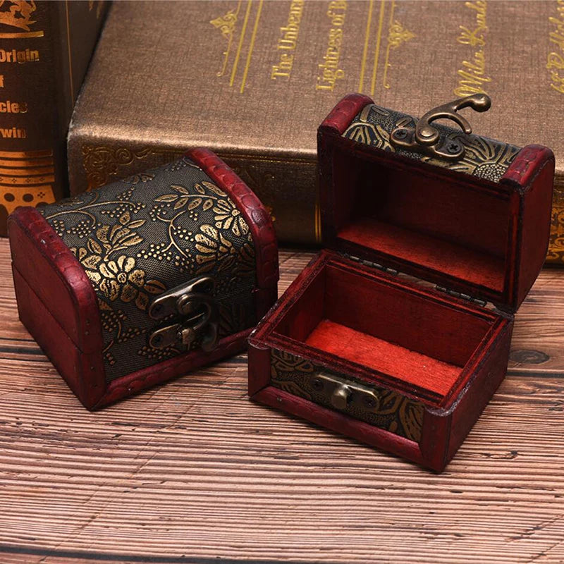 Decorative jewelry box with intricate designs on a wooden surface