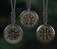 Three circular pendants with intricate designs on a dark background, featuring the brand 'VGDS'.