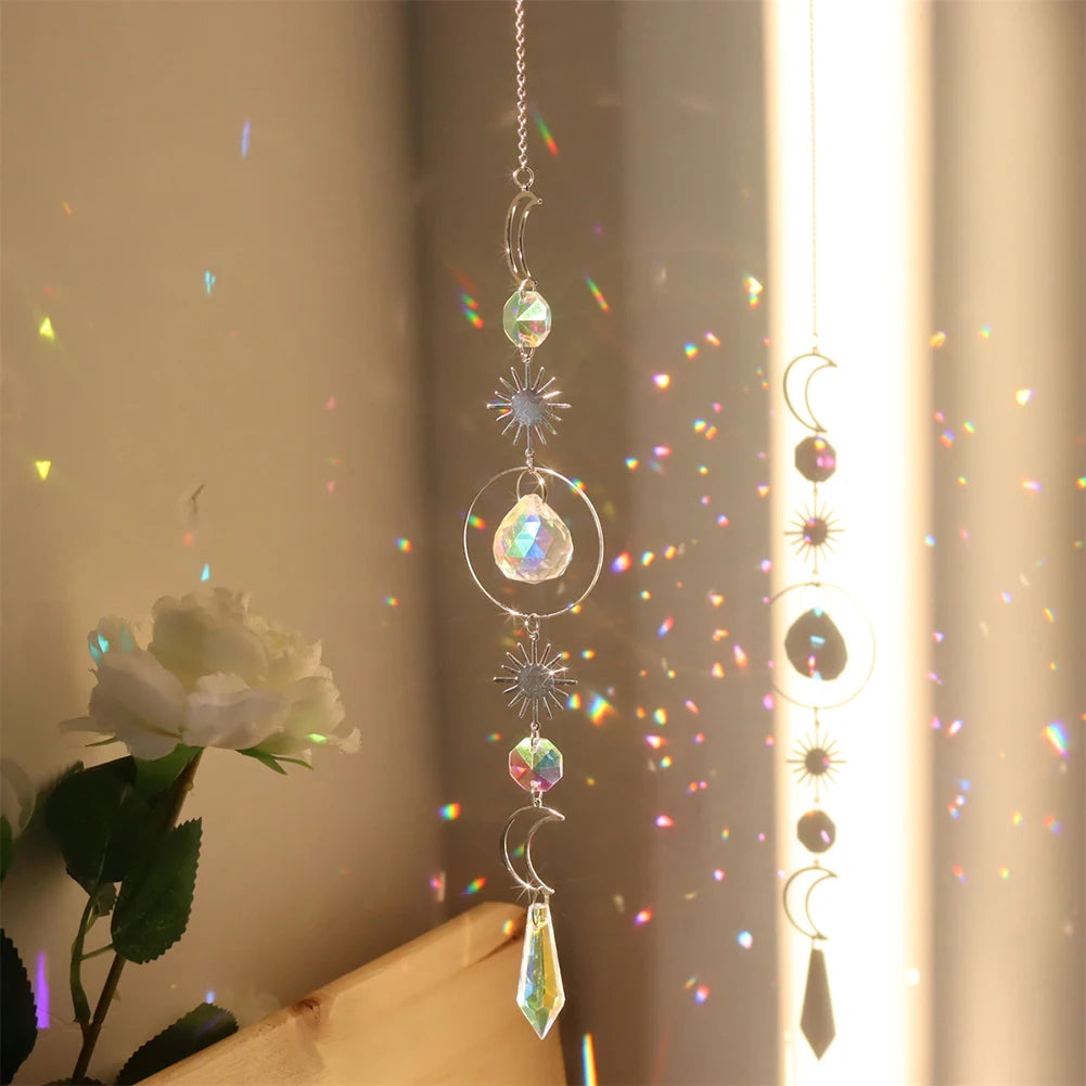 Decorative hanging crystal with rainbow, placed against a neutral background.