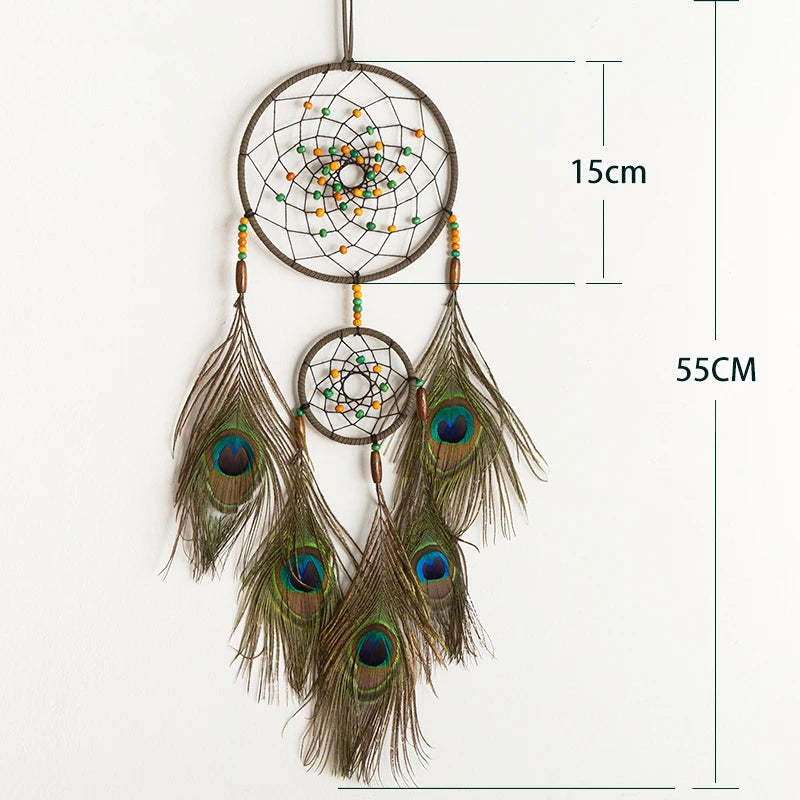 Dreamcatcher with peacock feathers and measurements on a white background