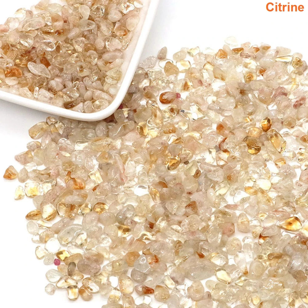 Citrine gemstones with a white dish on a light background